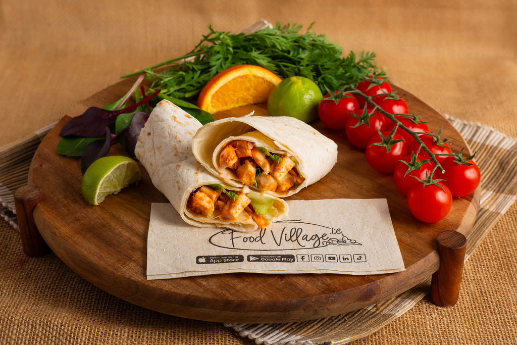 Food Village School Meals Sliced Irish chicken breast, crisp lettuce and sweet chilli sauce wrapped in a soft tortilla wrap.<br />